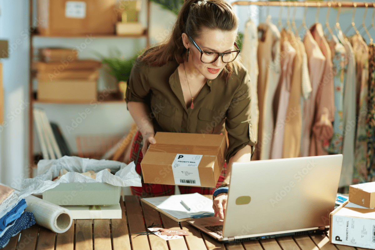 Female small business owner managing online orders to get more leads and sales