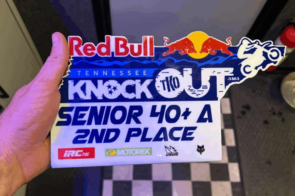  A hand holding the "Red Bull Tennessee Knockout" award plaque, which shows "Senior 40+ A" and "2nd Place," with the Spectruss logo visible.