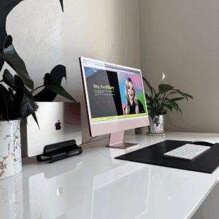 Pink iMac desktop displaying a high-quality Custom Website design for a creative small business, emphasizing design and strategy.