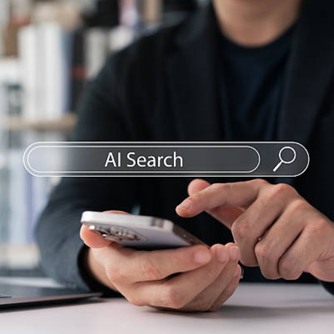 A person using a phone with an "AI Search" bar overlayed; preparing content for Answer Engine Optimization.