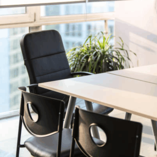 Empty executive office chair representing Fractional CMO service leadership for growing service businesses