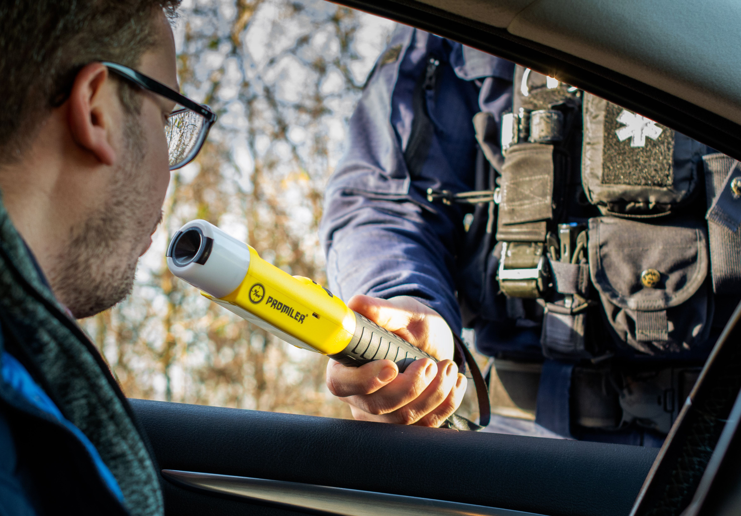 officer administering breathalyzer test to driver during DUI stop in Tennessee